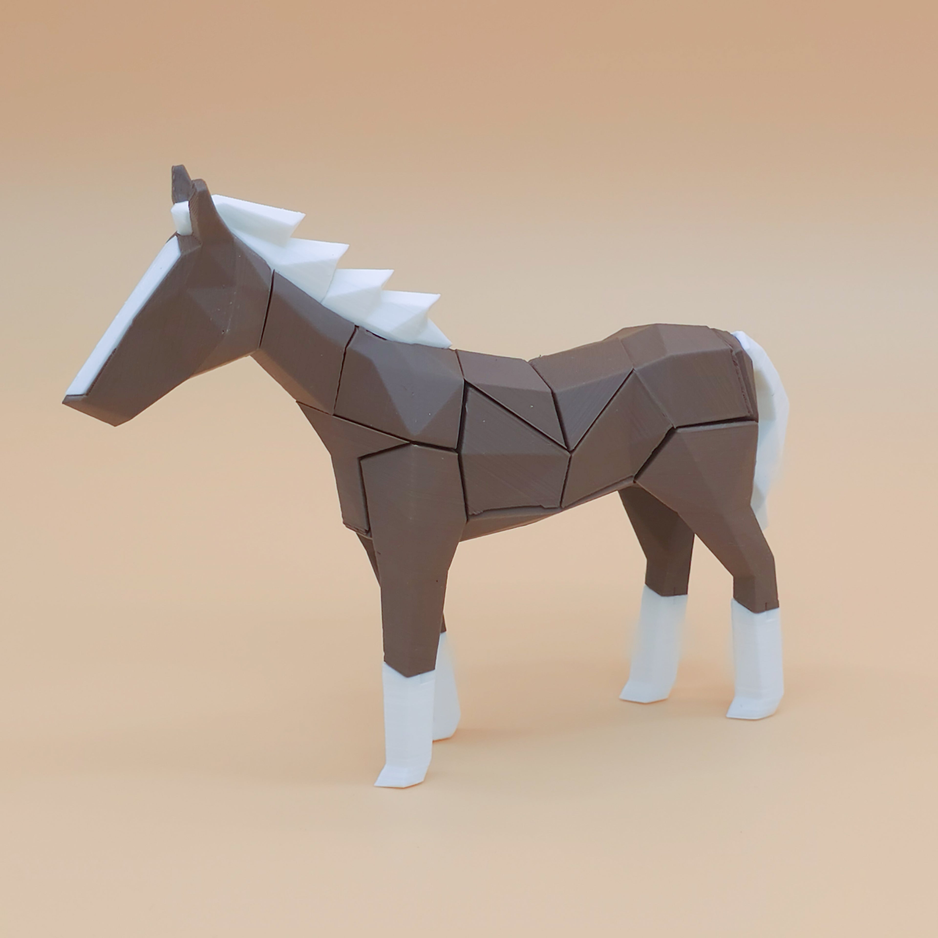 Brown and white magnetic horse puzzle on a beige background