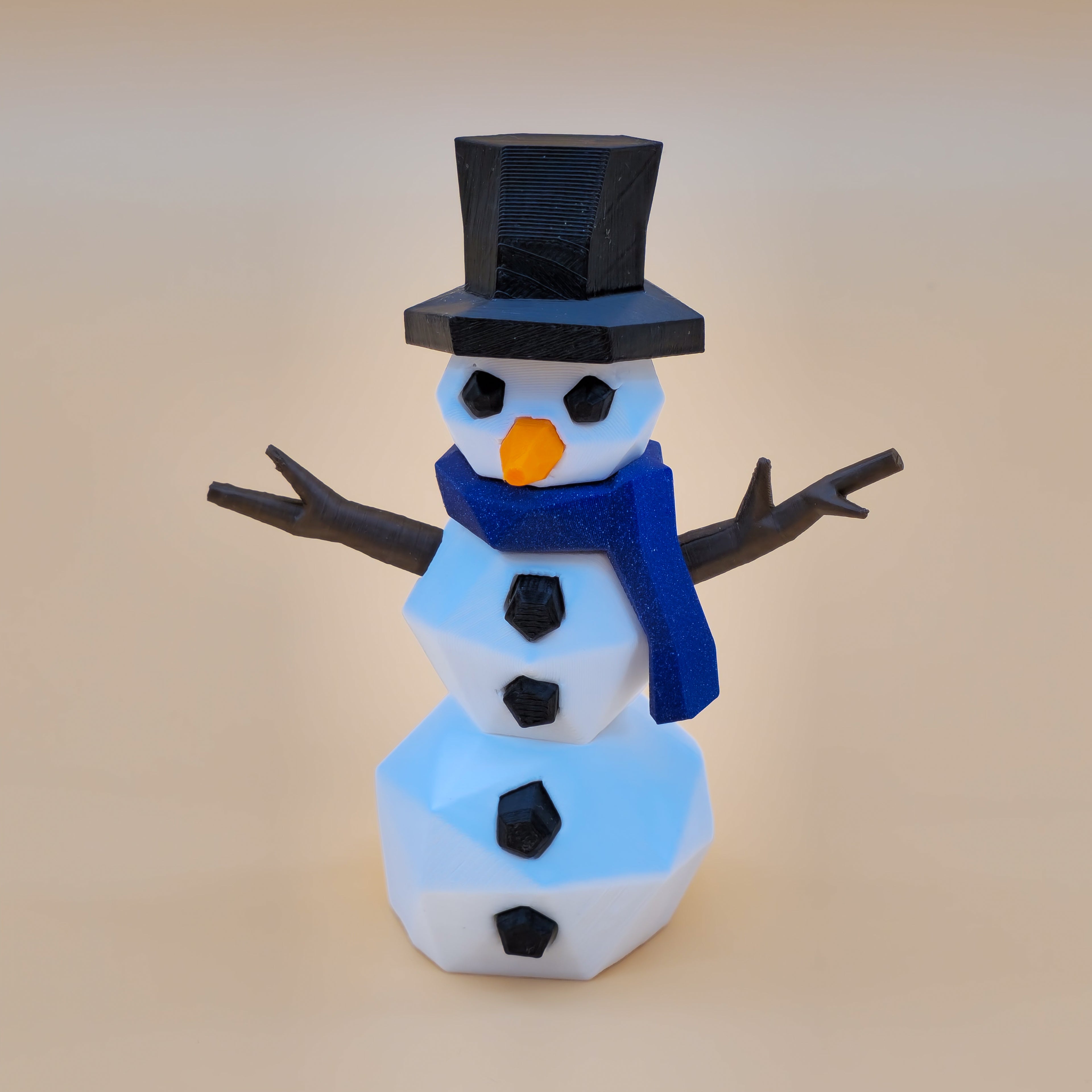 3D-printed snowman puzzle with a black top hat, blue scarf, and carrot nose on a beige background.