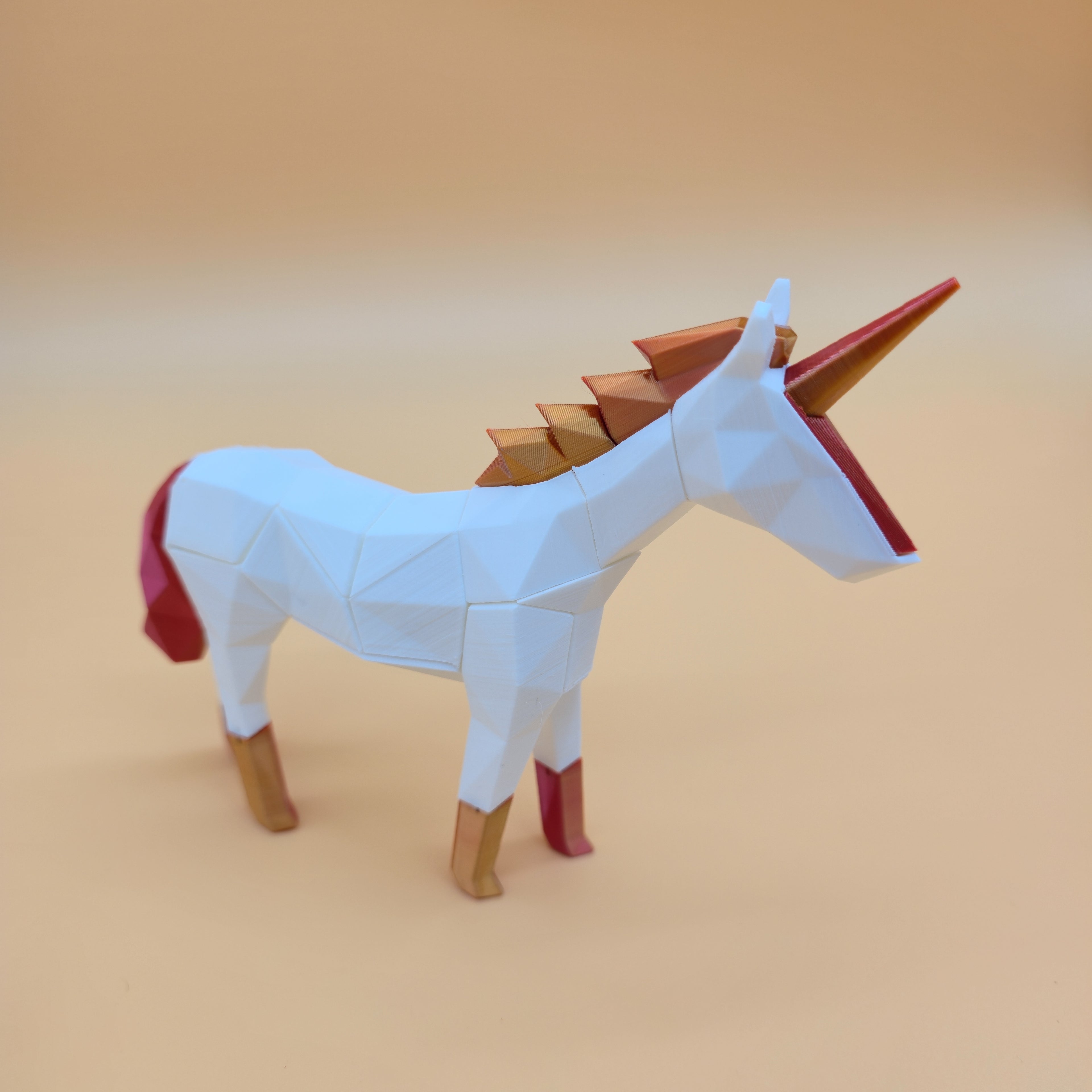 White unicorn puzzle with red mane and tail on a beige background